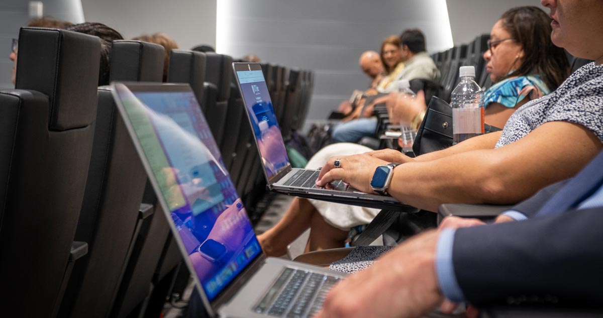 people typing on laptops