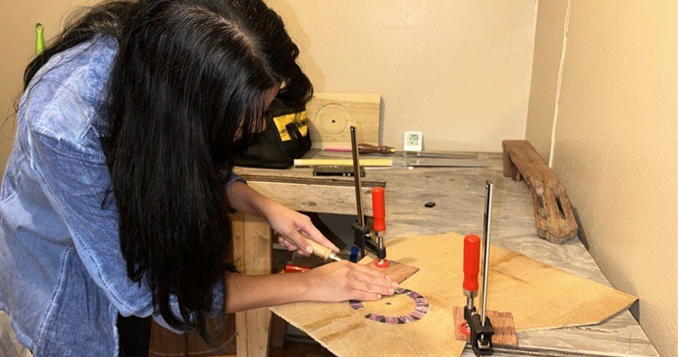 student building classical guitar