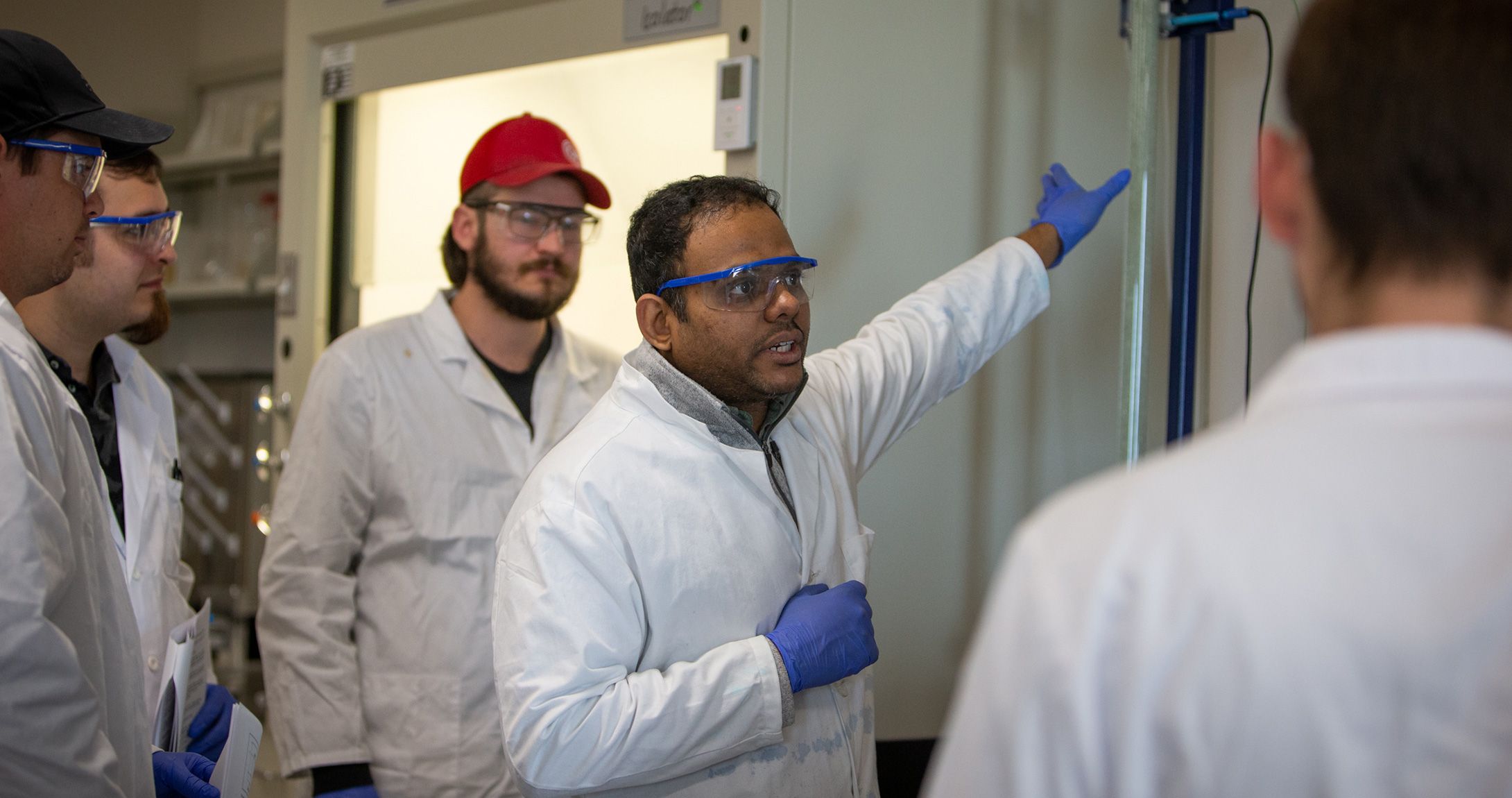 Narendra Boppana teaching in a lab with students