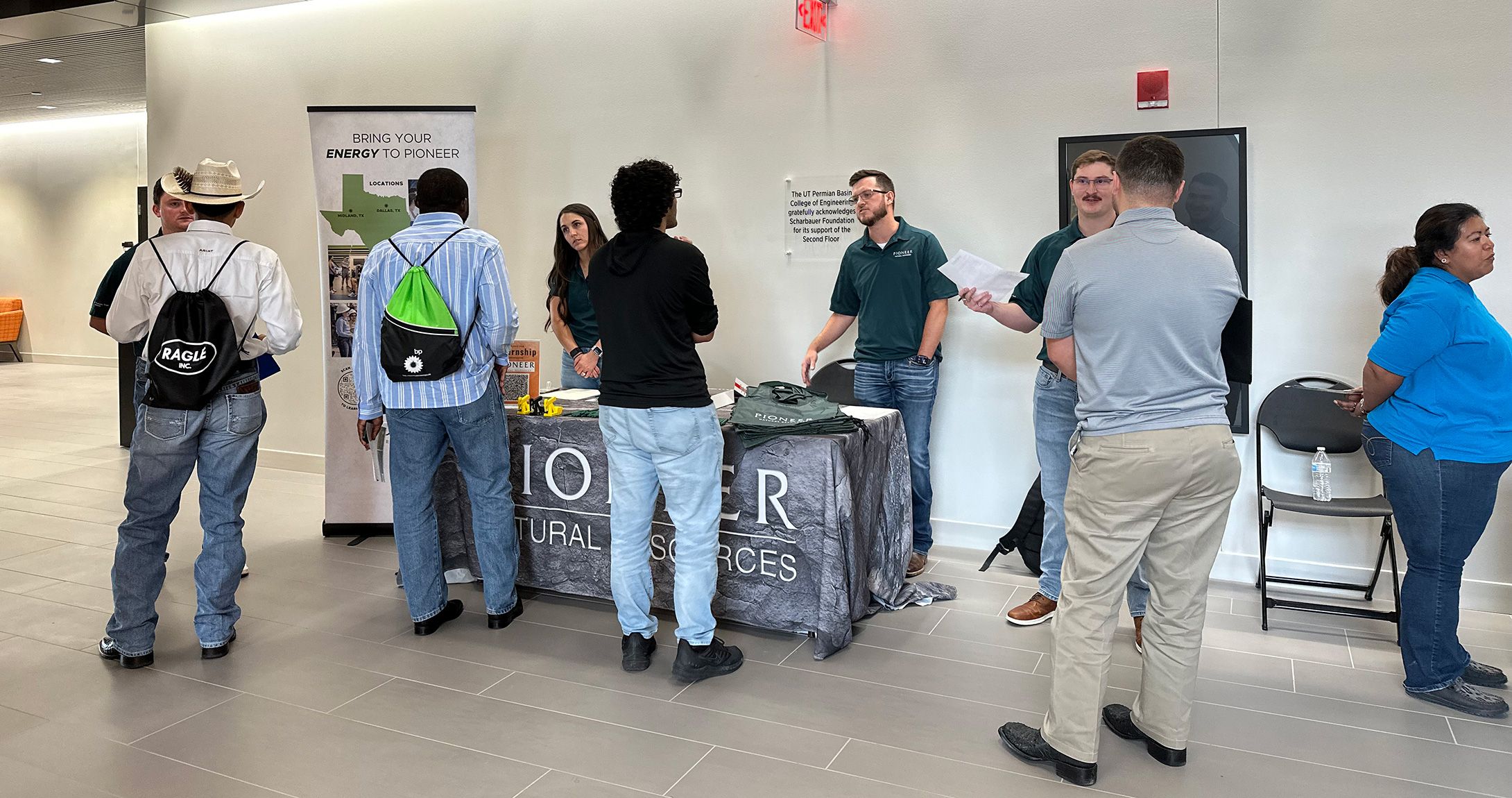 Engineering students talking to employers at the engineering building