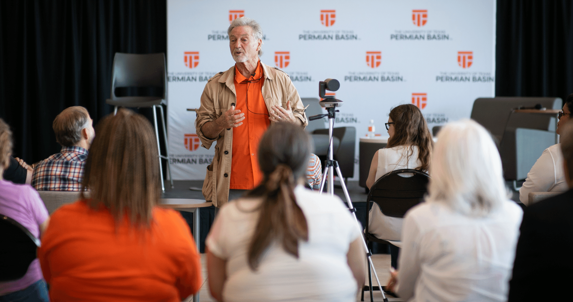 Larry gatlin speaking to audience
