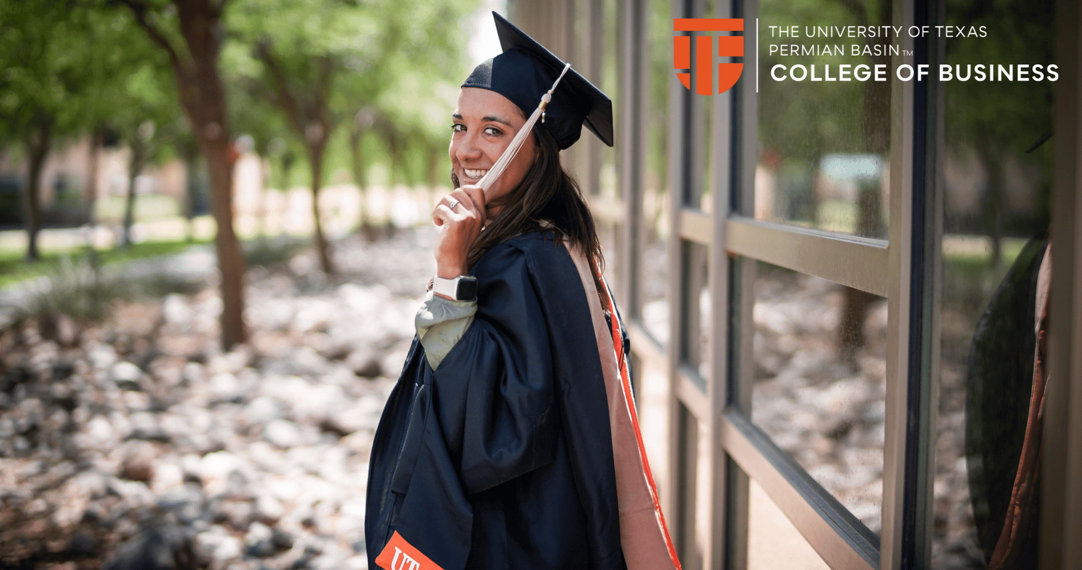 graduate student with grad cap looking back