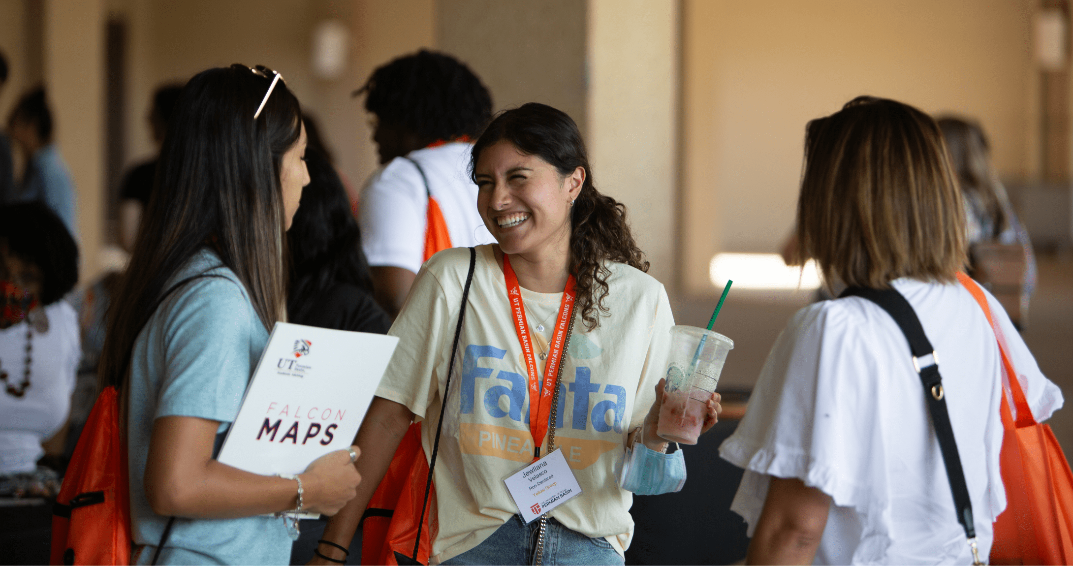 student laughing talking to friends