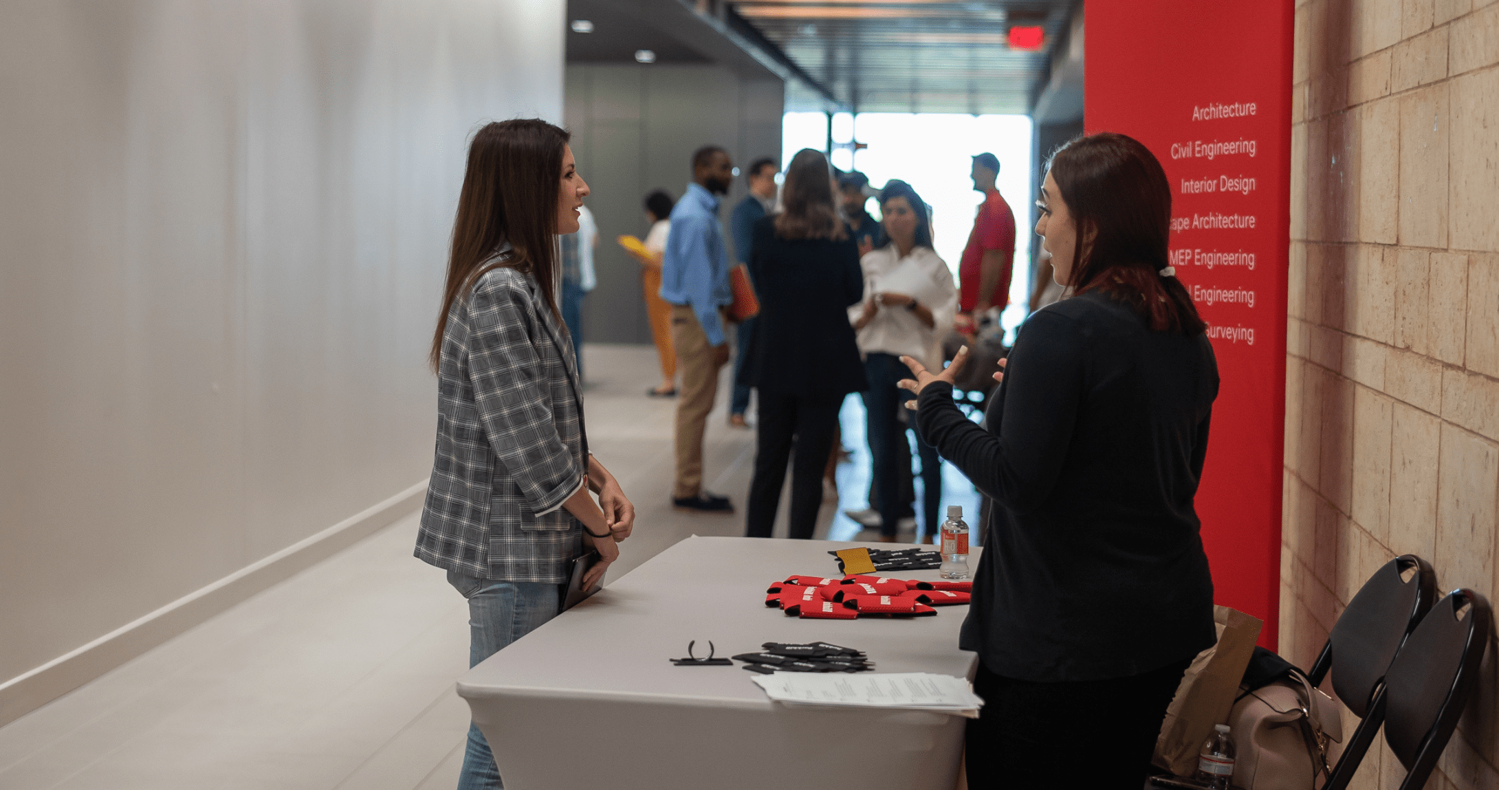 Thalia Balderas talking with company at engineering internship fair