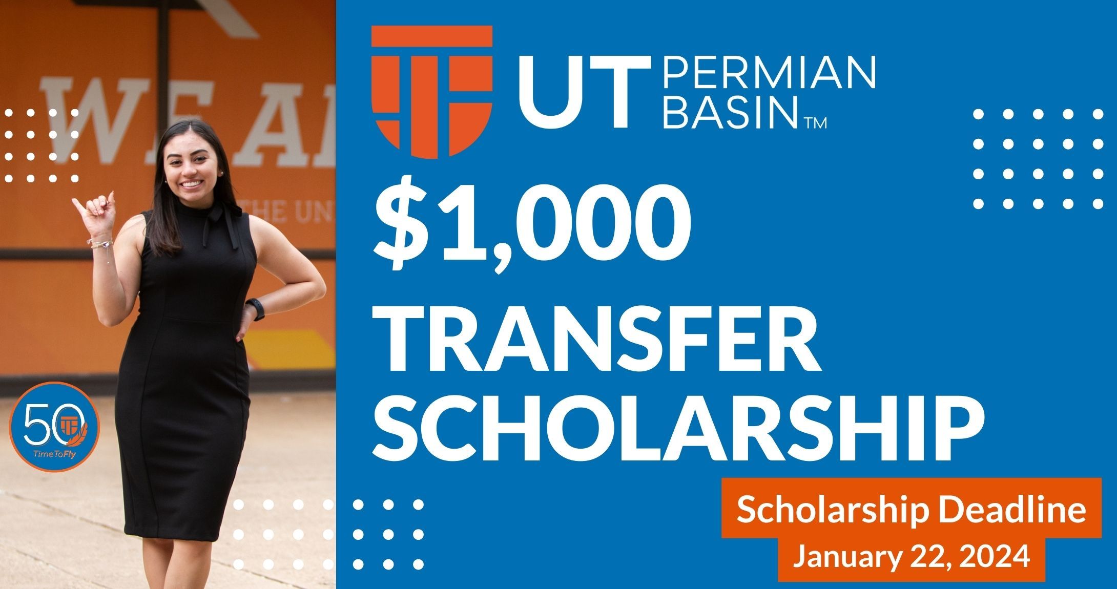 student giving falcons up sign